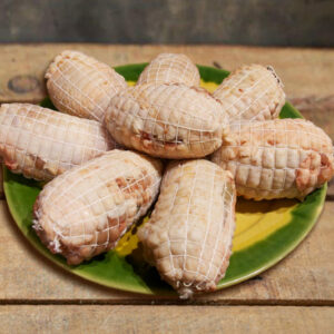 Foto de muslos de pollo con setas rellenas de gambas - Lo cistell